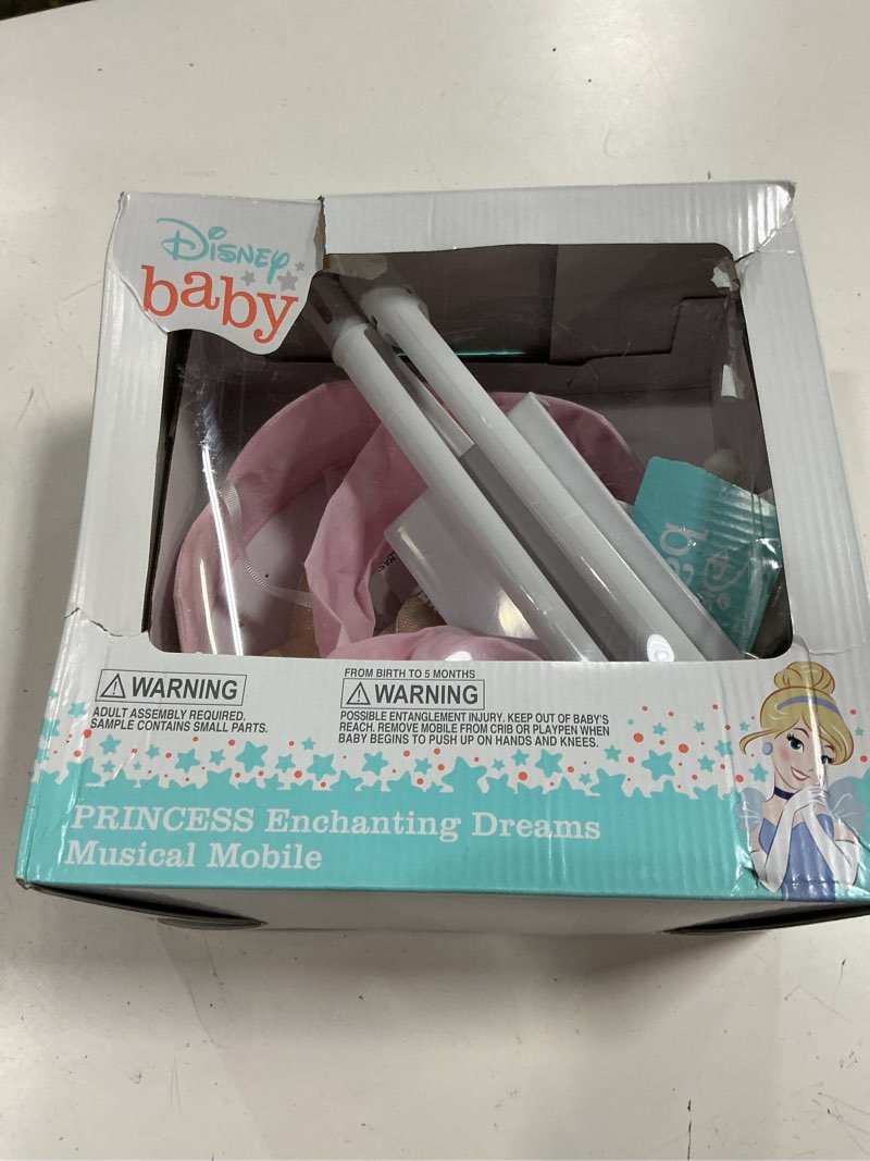 Condition photo showing As Is for disney princess enchanting dreams pink and gold crown, stars, and slipper musical mobile