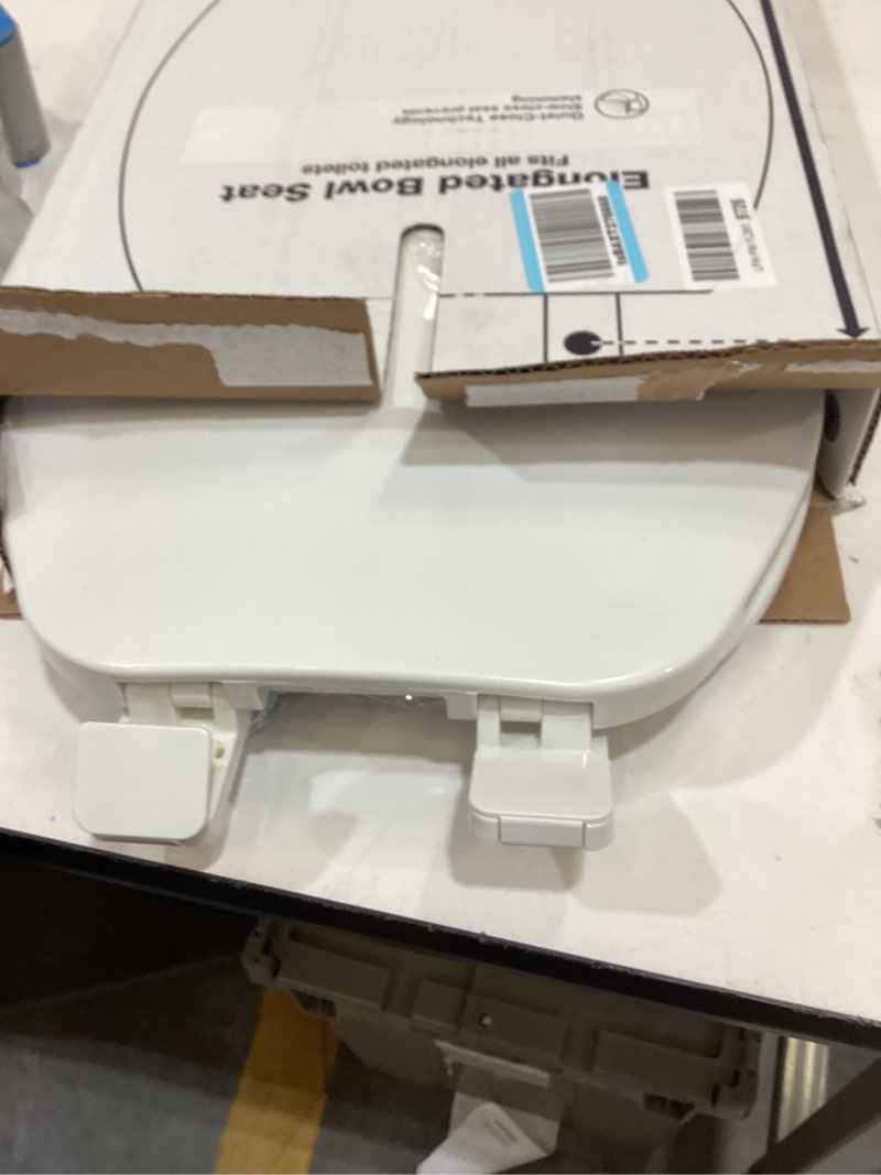 Condition photo showing As Is for kohler 20110-0 brevia, slow close toilet seat, elongated toilet seat, grip-tight bumpers quick-attach hardware, white white elongated quiet-close