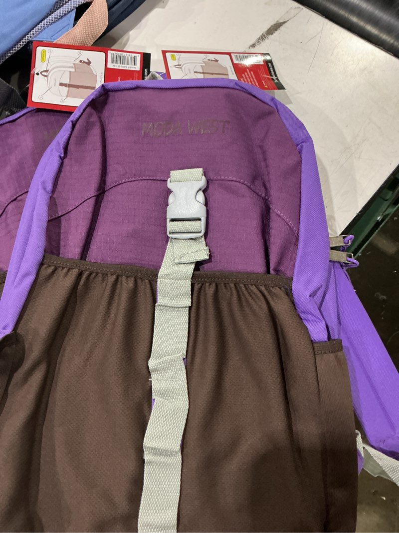 Condition photo showing Good Condition for purple and brown moda west backpack featuring a vertical strap and buckle