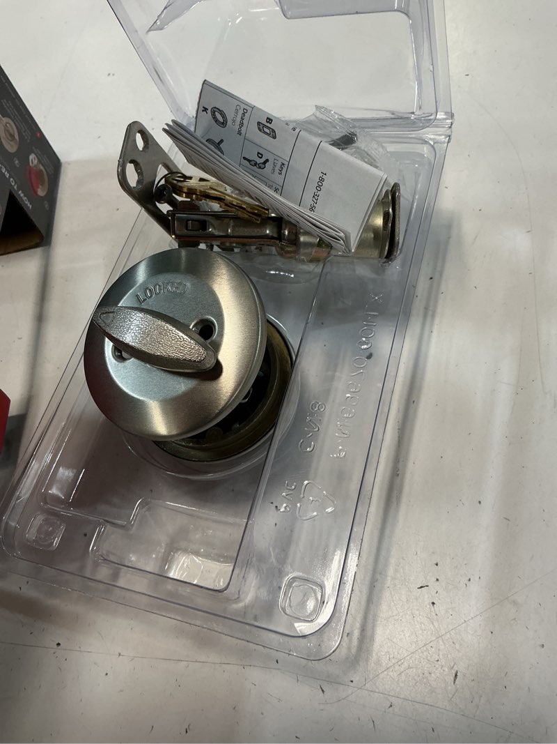 Condition photo showing As Is for kwikset smartkey satin nickel metal deadbolt