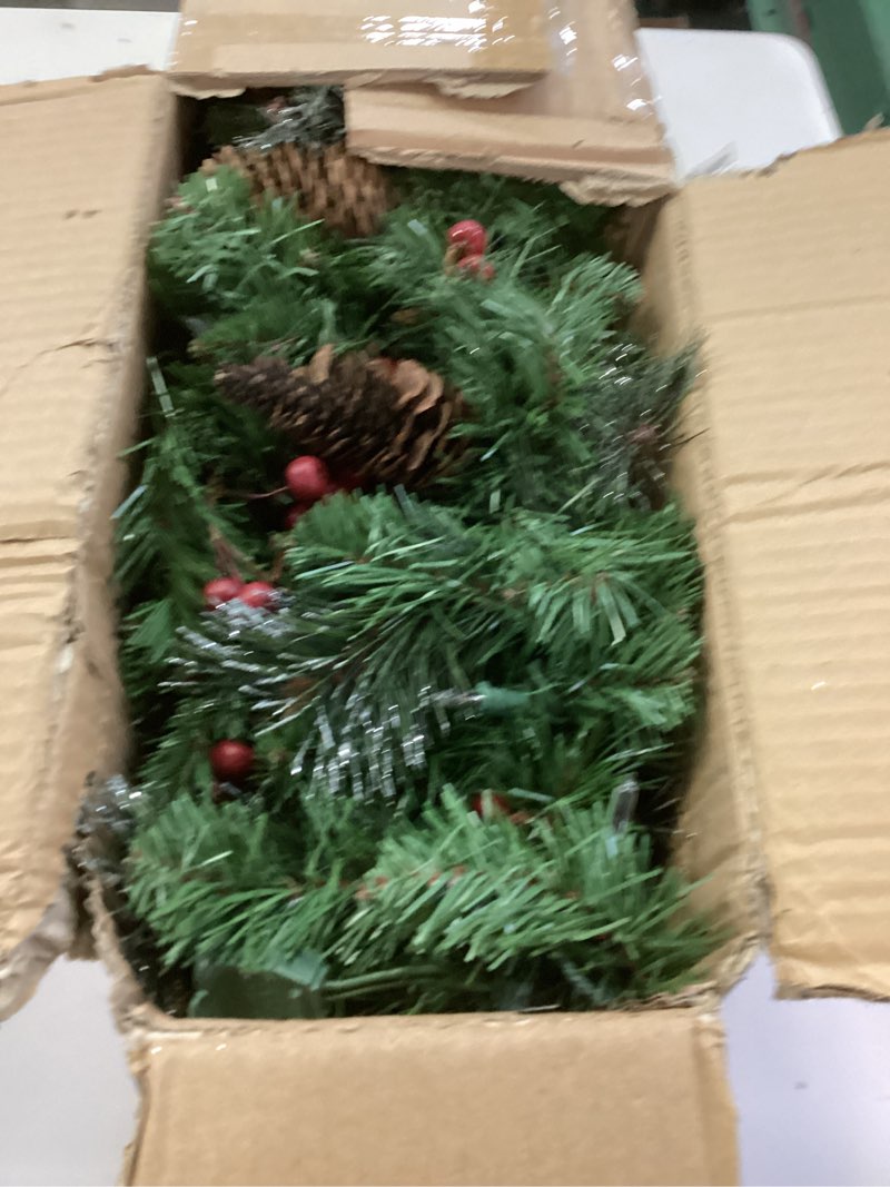 Condition photo showing As Is for National Tree Company 9 ft Pre-Lit Crestwood Spruce Artificial Christmas Garland, Christmas Decoration with Glitter, Pinecones, Red Berries, 50 Clear Lights, 180 Tips, Green Plug In Tree