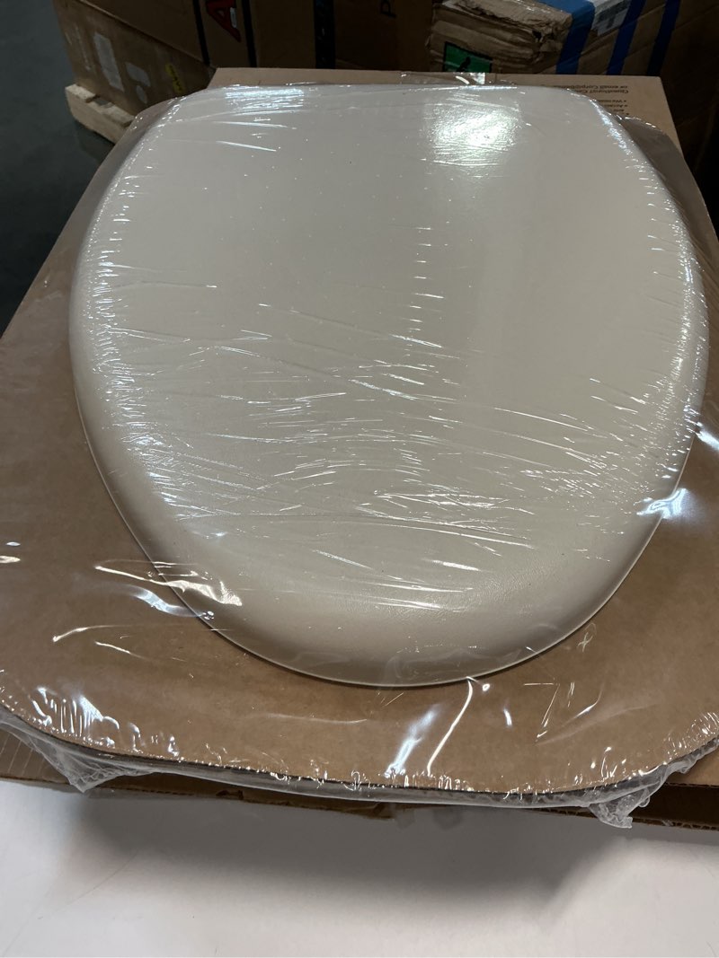 Condition photo showing New/Like New for Mayfair Padded Toilet Seat, Cushioned Soft Vinyl over Wood Core Seat, Secure Hinges, Easy Clean, Made in USA, Elongated, Bone Round Bone Toilet Seat