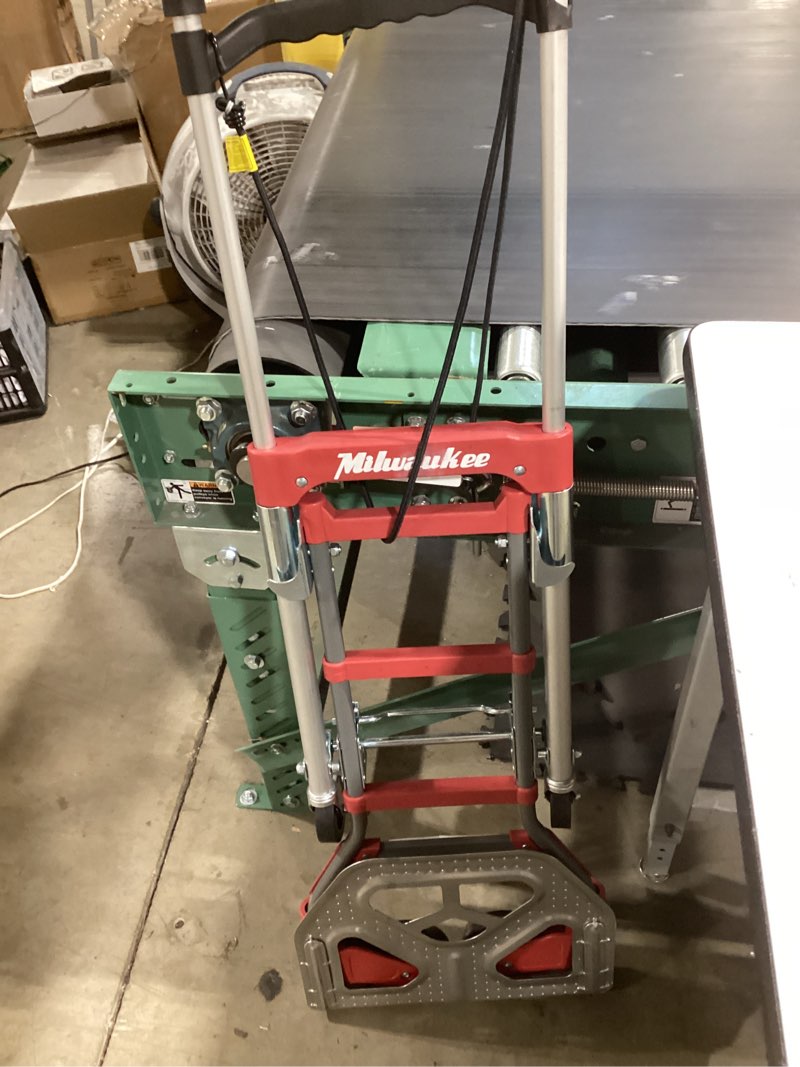 Condition photo showing As Is for milwaukee 150-lb capacity 2 -wheel red steel folding hand truck