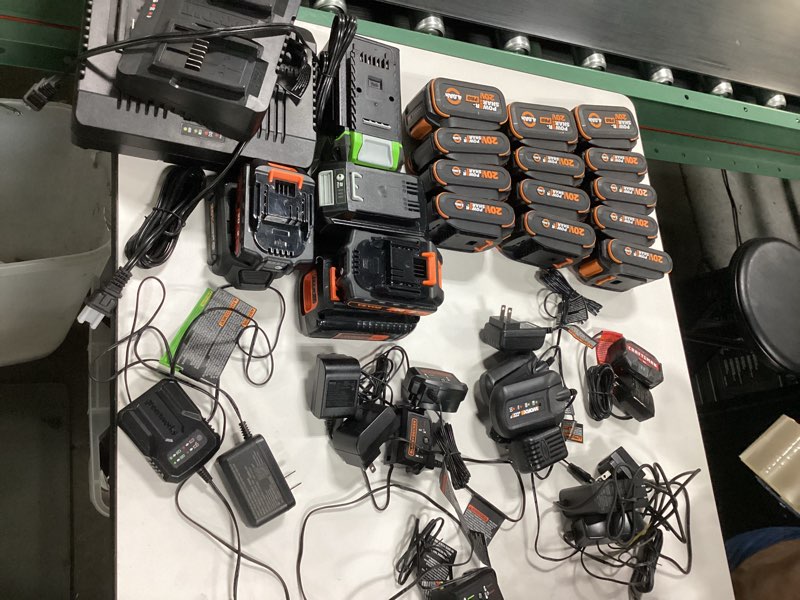Assorted batteries and chargers different sizes and brands