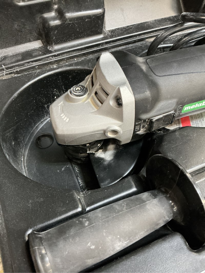 Condition photo showing As Is for metabo hpt 4.5-in 6.2 amps sliding switch corded angle grinder (charger not incldued)