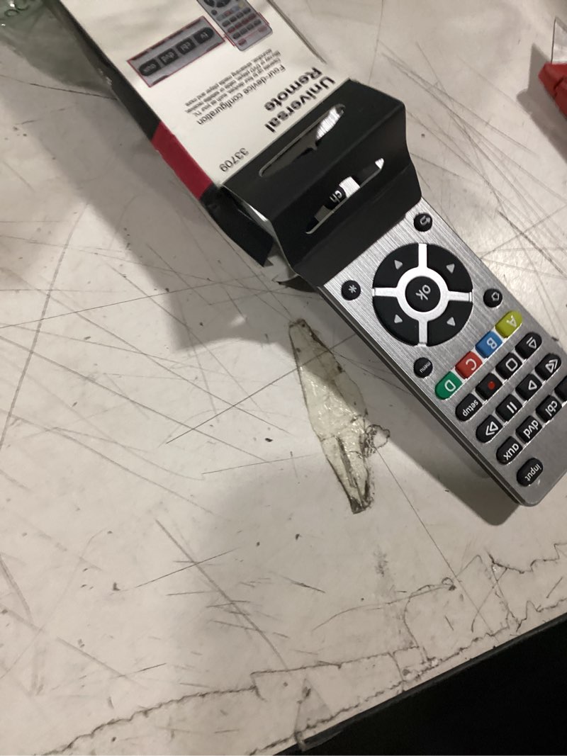 Condition photo showing As Is for ge 4-device universal remote control, designer series, brushed nickel/silver, 33709