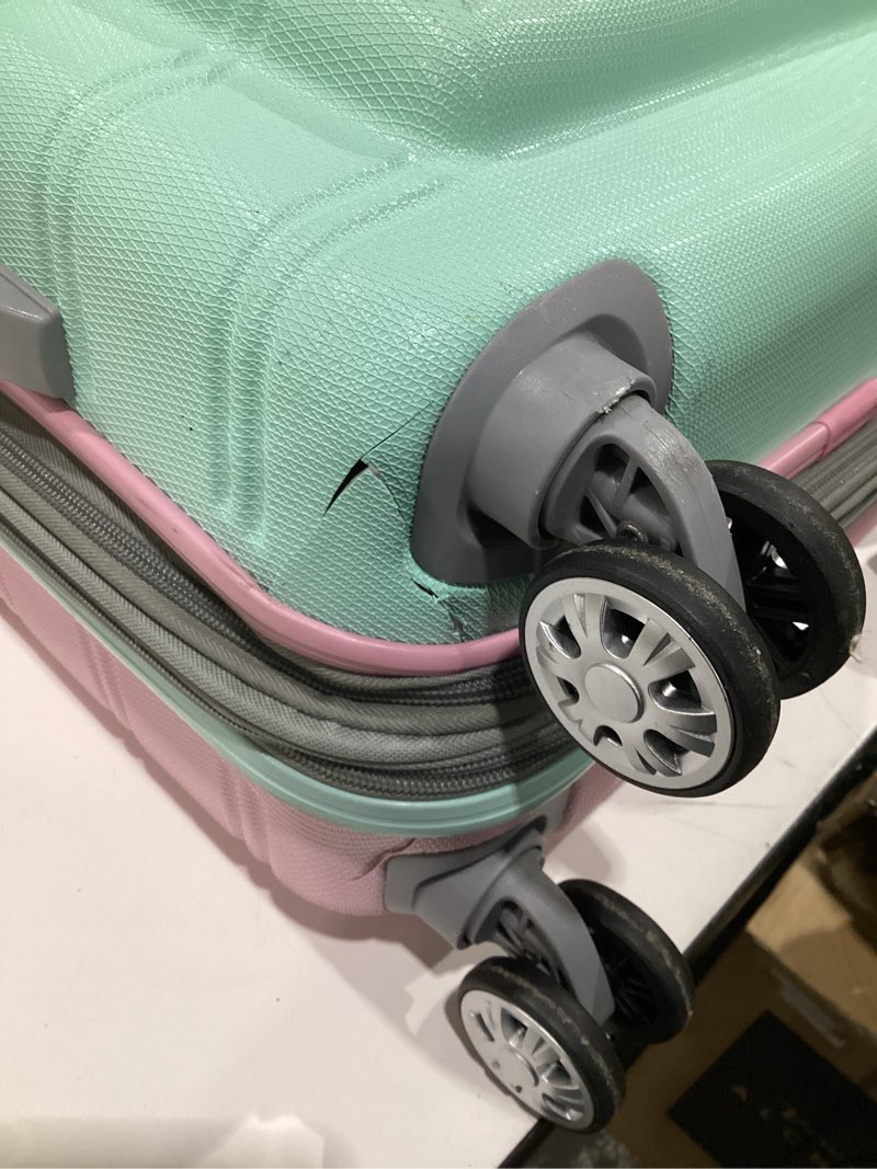 Condition photo showing As Is for (USED, DAMAGED) Rockland London Hardside Spinner Wheel Luggage, Mint, Carry-On 20-Inch Multicolor Carry-On 20-Inch