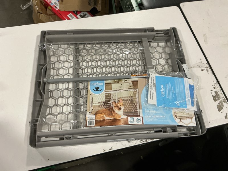 Condition photo showing As Is for carlson pet products easy fit plastic adjustable expandable pet gate 28-42"