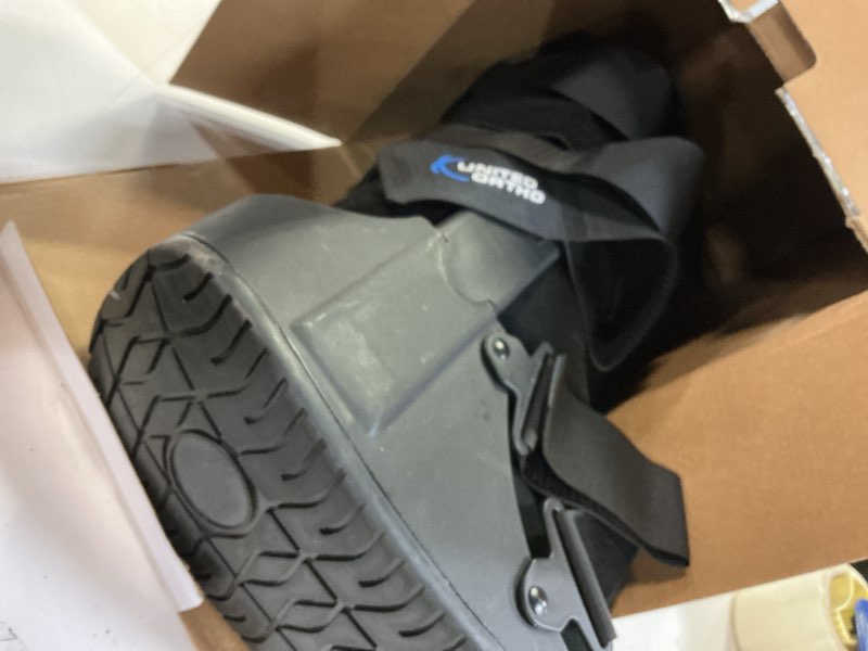 Condition photo showing As Is for United Ortho Cam Walker Fracture Boot, Medium, Black Black Medium