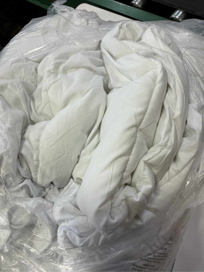 Condition photo showing As Is for amazon basics white down alternative comforter and duvet insert with corner tabs, machine washable, king, light white king light