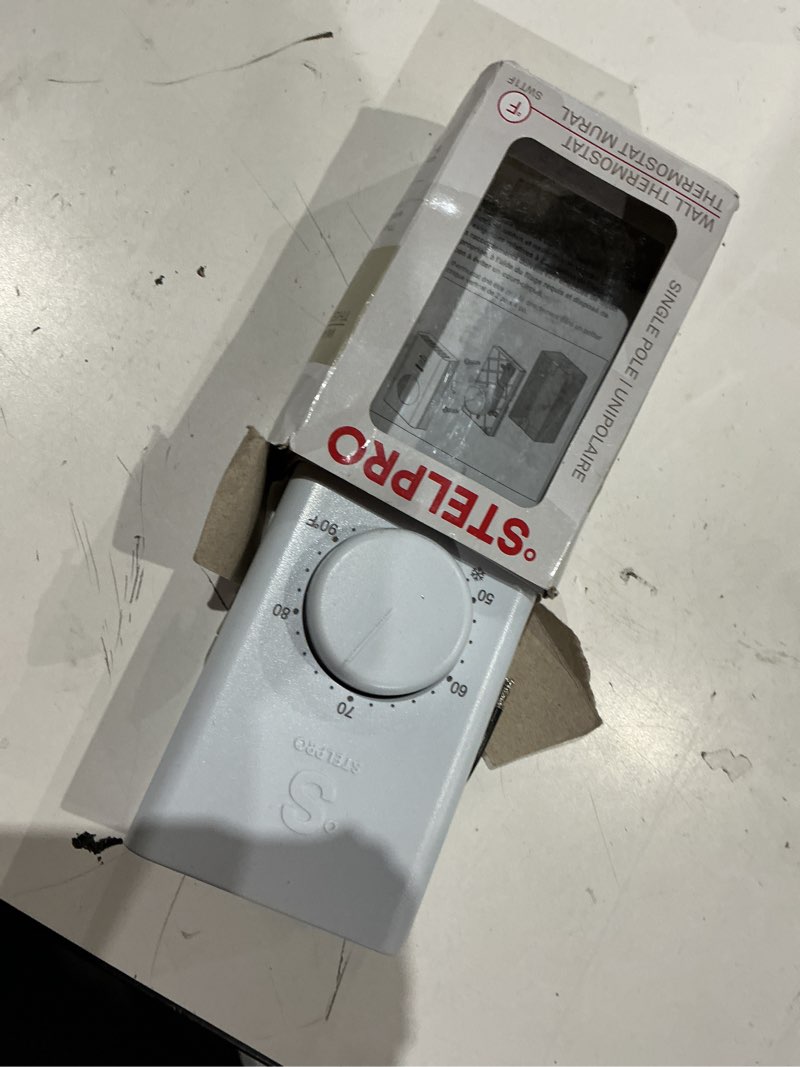 Condition photo showing As Is for stelpro single pole line voltage thermostat, mechanical 240 volts, compatible with most heating products (electric baseboards, wall fan heaters or commercial fan-forced heaters), (swt1f) white