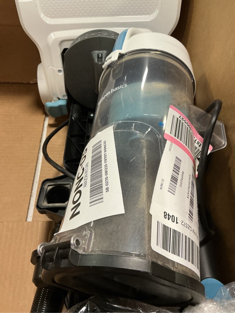 Condition photo showing As Is for Product used, Amazon Basics Upright Bagless Vacuum Cleaner for Carpet and Hard Floors, With Crevice and Upholstery Tools, Detachable Handle, Lightweight (8.4 lbs), 1.7L Dust Cup, 720W, 25ft Cord, Black/White