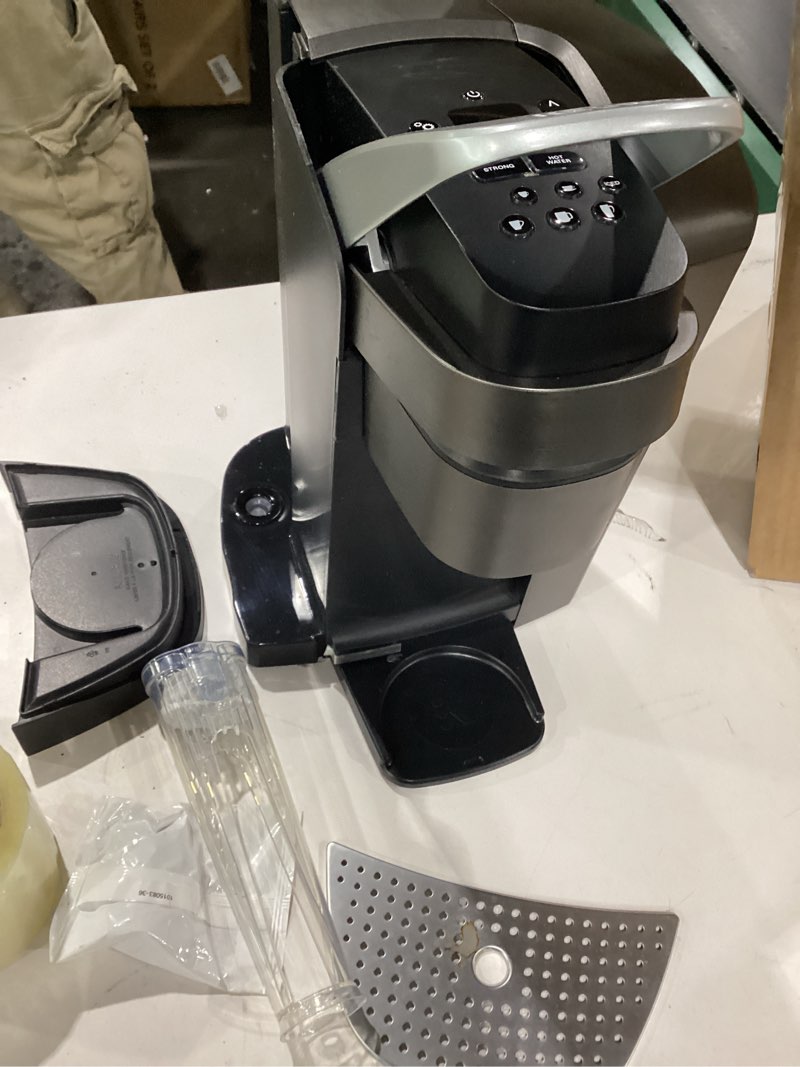 Condition photo showing As Is for Keurig K-Elite Single Serve K-Cup Pod Coffee Maker, with Strength and Temperature Control, Iced Coffee Capability, 8 to 12oz Brew Size, Programmable, Brushed Slate (NOT TESTED)