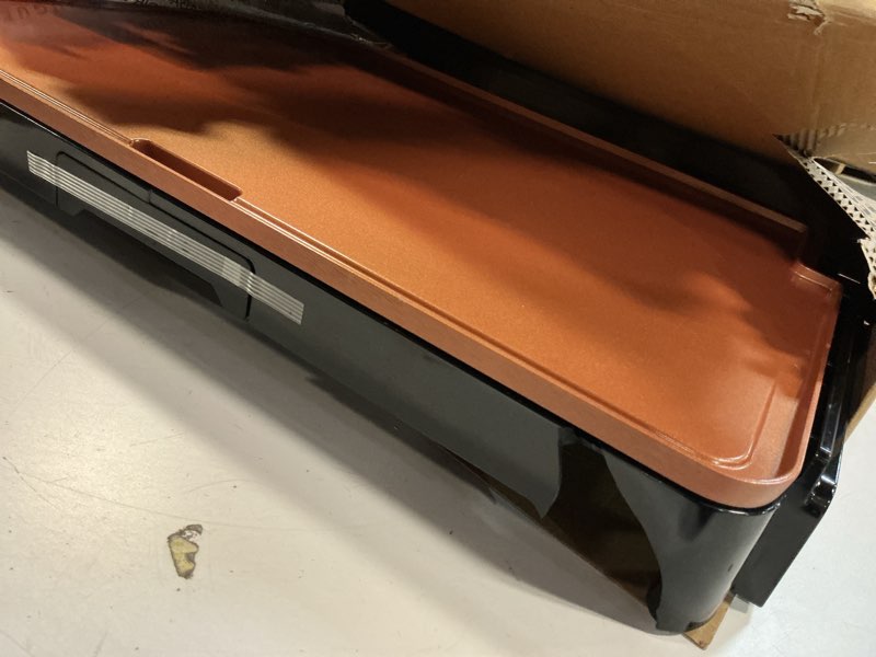 Condition photo showing As Is for bella XL Electric Ceramic Titanium Griddle, Make 15 Eggs At Once, Healthy-Eco Non-stick Coating, Hassle-Free Clean Up, Large Submersible Cooking Surface, 12" x 22", Copper/Black 12" x 22" Copper