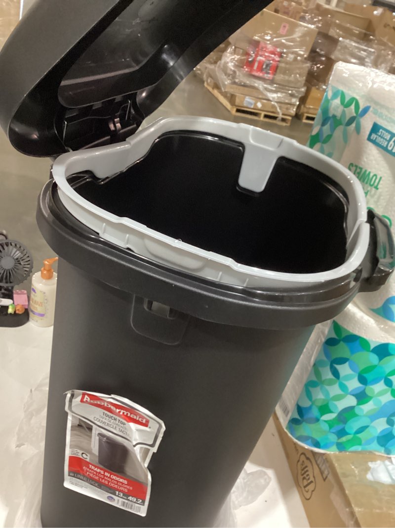 Condition photo showing As Is for rubbermaid 13 gal black plastic touch top trash can damaged