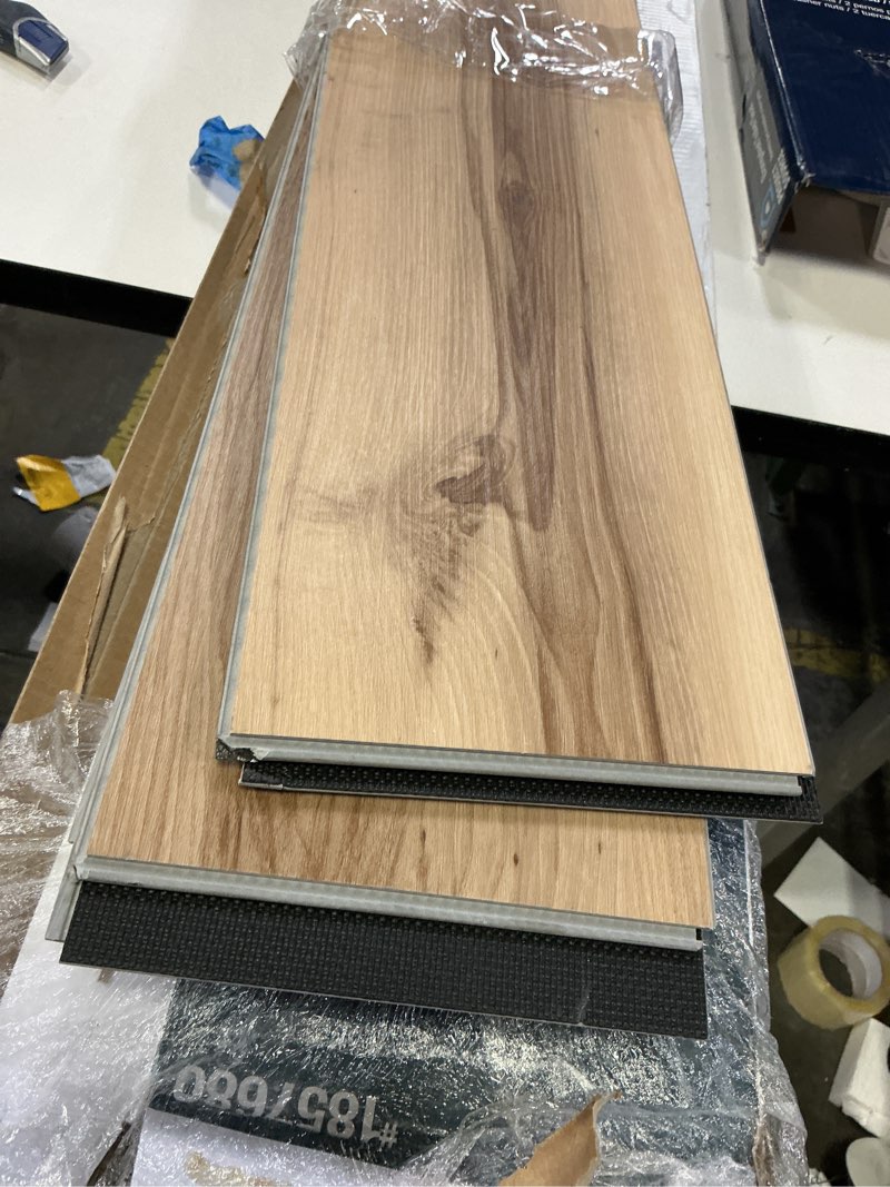 Condition photo showing item condition for Style Selections Jamestown Hickory 12-mil x 7-in W x 48-in L Waterproof Luxury Vinyl Plank