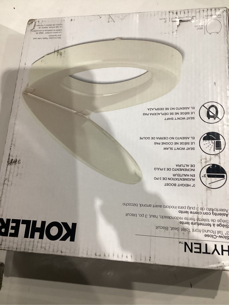 Condition photo showing item condition for kohler 25876-96 hyten 3" height, elevated soft close round toilet seat, contoured seat with grip-tig
