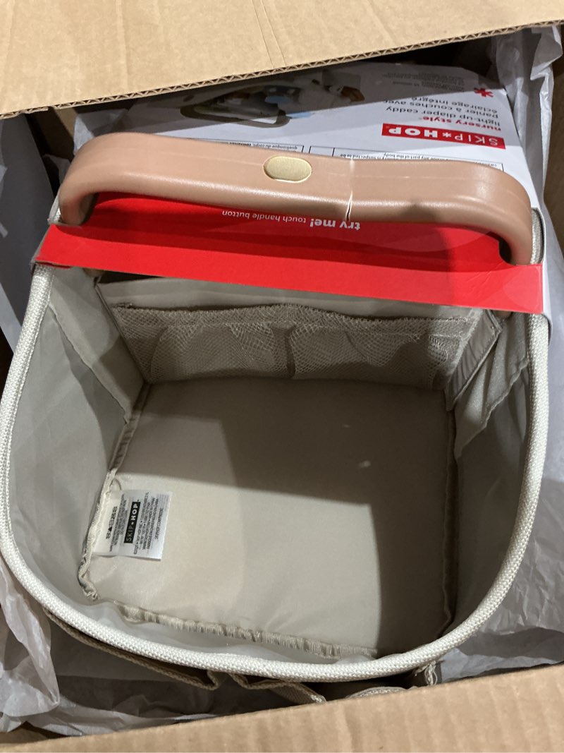 Condition photo showing As Is for skip hop diaper caddy organizer with touch sensor night light nursery style oat light-up diaper caddy oat