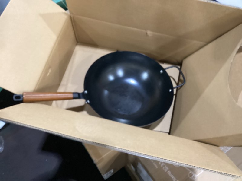 Condition photo showing As Is for amazon basics carbon steel pre-seasoned wok, all cooktop friendly, 12.6 in.