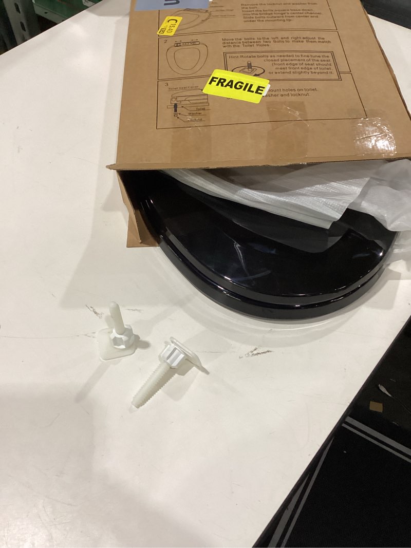 Condition photo showing Good Condition for Renovators Supply Manufacturing Black Plastic Soft Close Elongated Toilet Seat Quiet-Close Lid, Contoured Seat Easy To Install And Clean, Grip-Tight Bumpers With Adjustable Mounting Hardware Pack of 1 Black