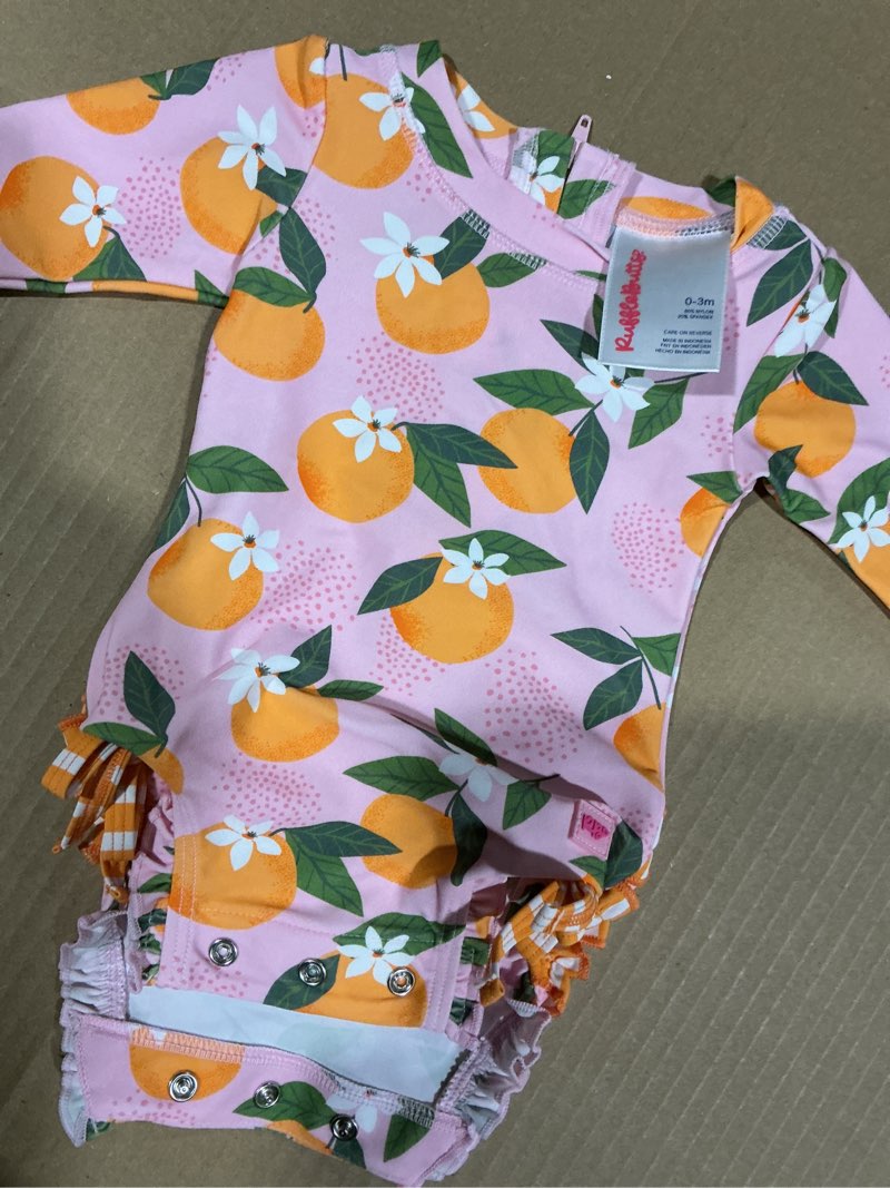 Condition photo showing Good Condition for RuffleButts Baby Girls UPF 50+ Sun Protection Floral Printed Long Sleeve One Piece Rash Guard Swimsuit with Zipper 0-3 Months Orange You the Sweetest