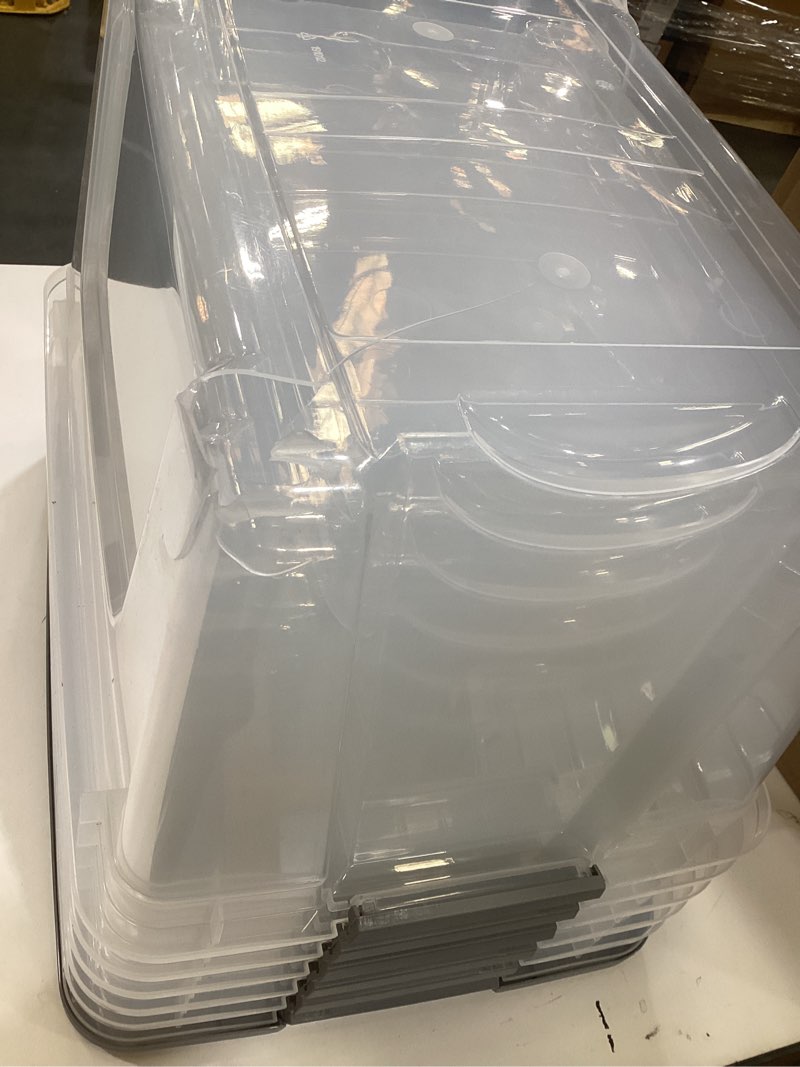 Condition photo showing As Is for amazon basics plastic storage containers with secure latching lids, stackable organization bins, clear/grey, 32 quart, set of 6 32 qt. - 6 pack