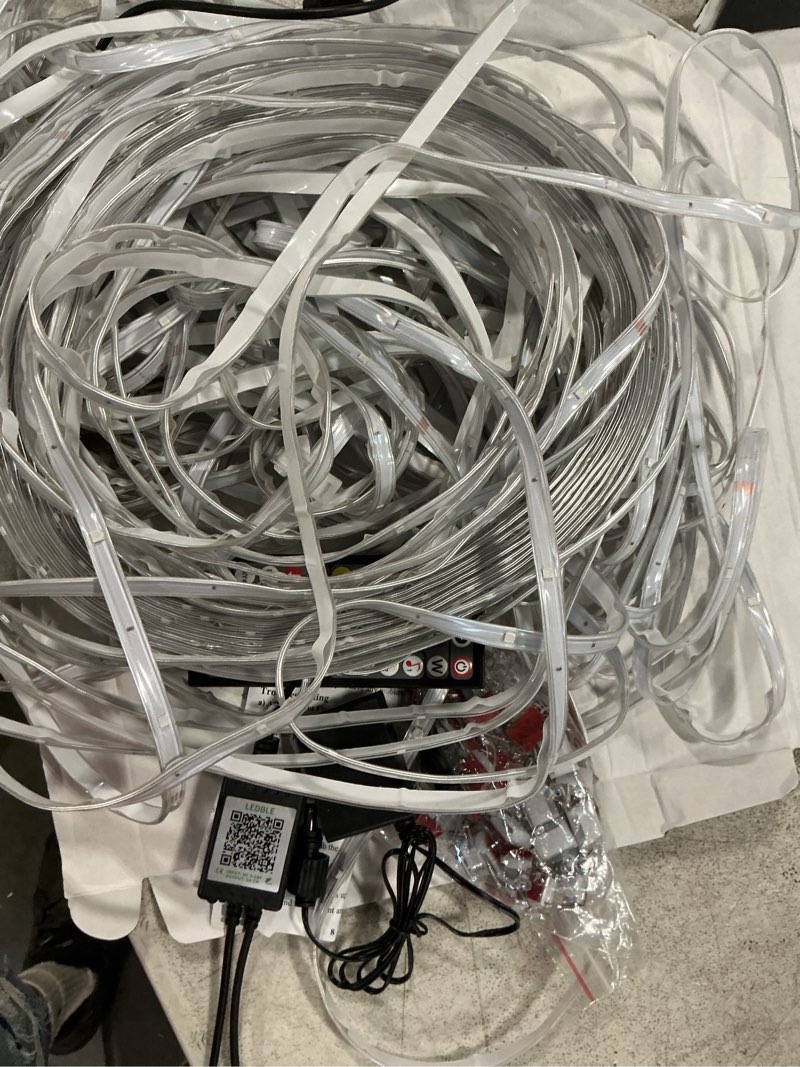 Condition photo showing As Is for 200ft outdoor rgb led strip lights, ip68 music sync led lights with app control and remote,color changing waterproof led rope lights for outdoor, balcony, roof, garden, stairs