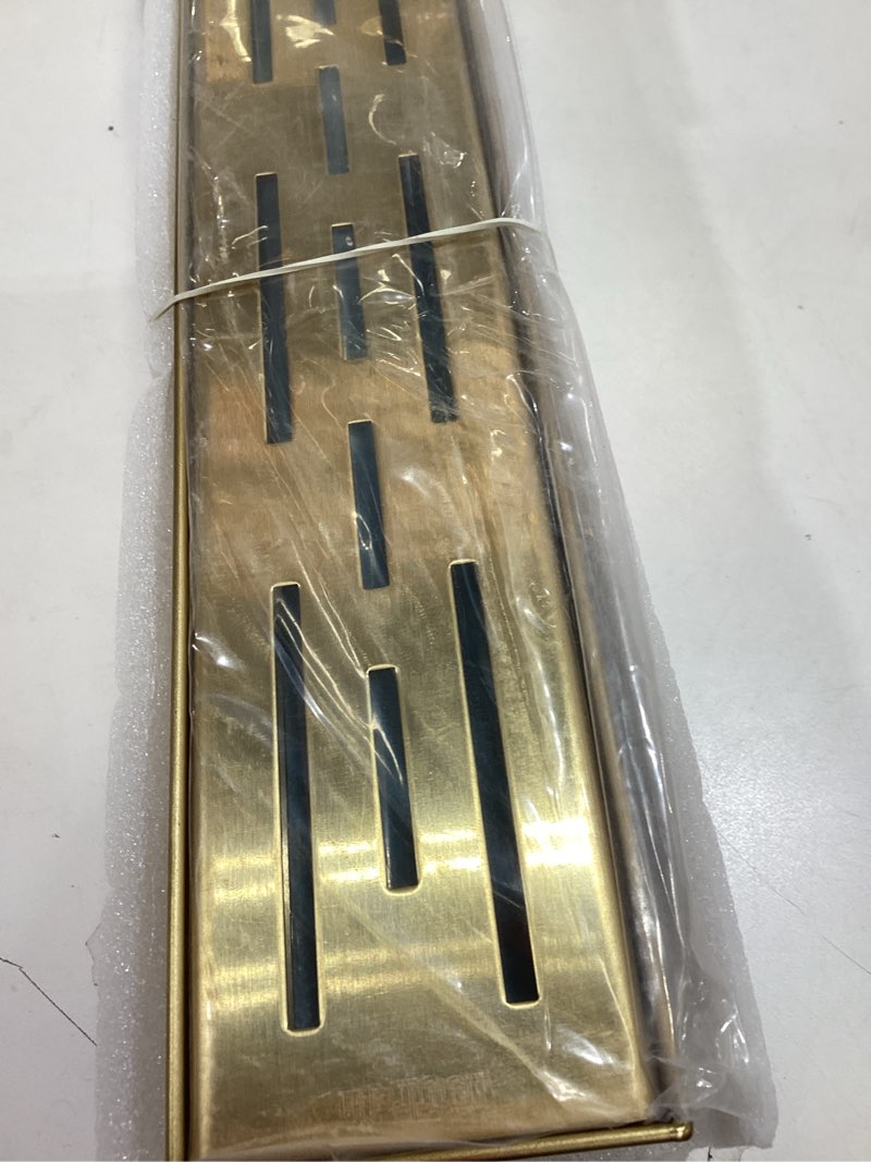 Condition photo showing Good Condition for neodrain 24-in brushed brass rectangular linear shower drain with brick pattern grate, 304 stainless steel bathroom floor drain, gold linear drain with hair strainer,cupc certified golden 24 in
