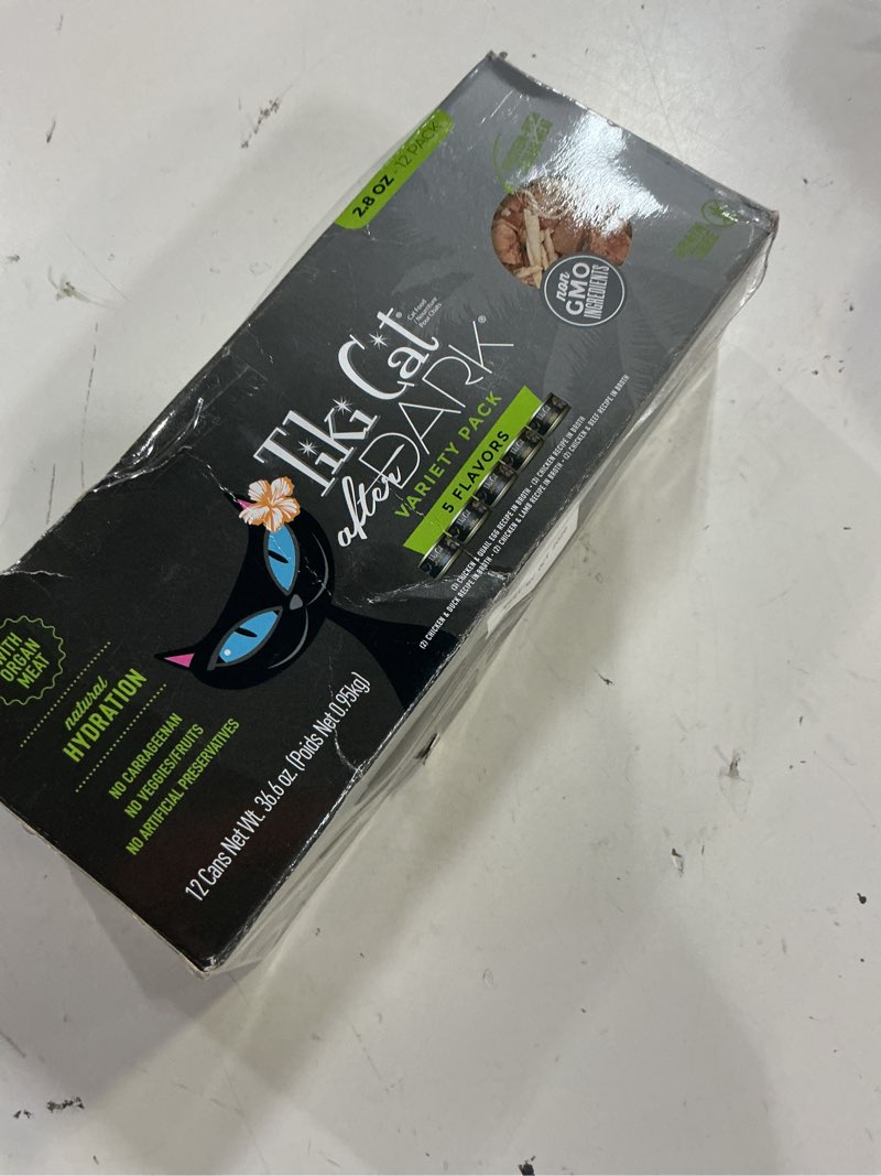 Condition photo showing New/Like New for (best by:oct/2028)tiki cat after dark, variety pack, high-protein and 100% non-gmo ingredients, wet cat food for adult cats, 2.8 oz. cans (pack of 12) 2.8 ounce (pack of 12)