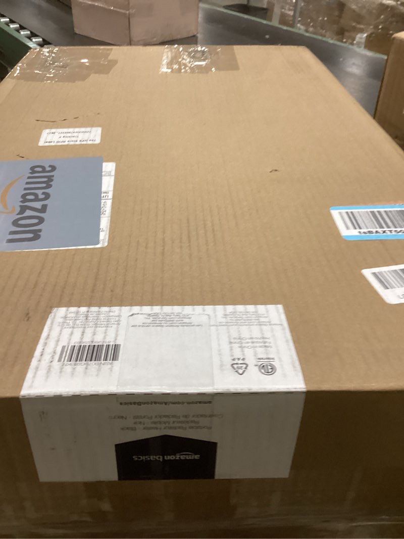 Condition photo showing New/Like New for Amazon Basics Portable Oil Radiator Heater for Indoor Use, 3 Heat Settings, Over-Heat Protection, ETL-certified Safety, 7 Oil-Filled Steel Fins, 1500W, 11"D x 14.8"W x 25.2"H, Black