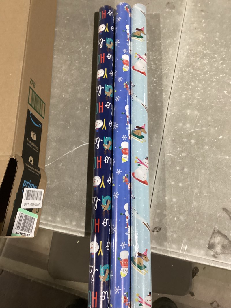 Condition photo showing New/Like New for Hallmark Reversible Christmas Wrapping Paper for Kids (3 Rolls: 120 Sq. Ft. Total) Snowmen, Stripes, Trees, Skiing Santa, Zebras, Hedgehogs, Penguins