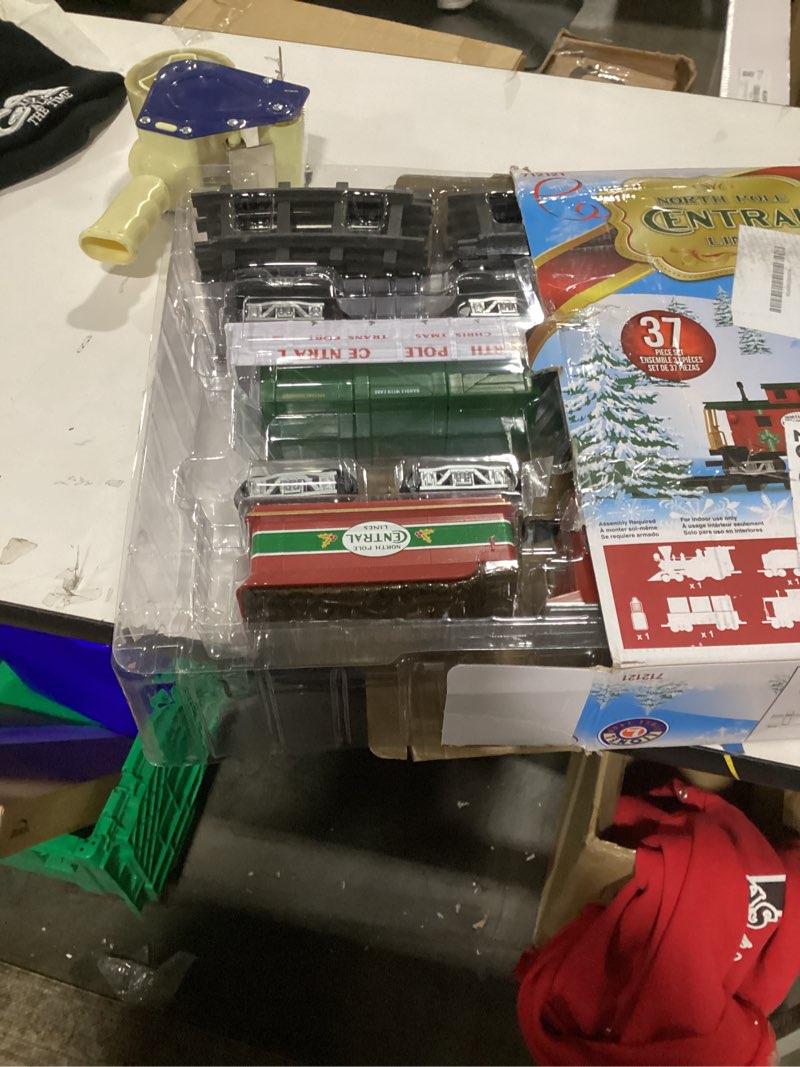 Condition photo showing As Is for Lionel Battery-Operated North Pole Central Freight Toy Train Set with Bluetooth, Locomotive, Train Cars, & Track with Authentic Train Sounds, Lights, & Water Vapor Smoke Effects for Kids 4+