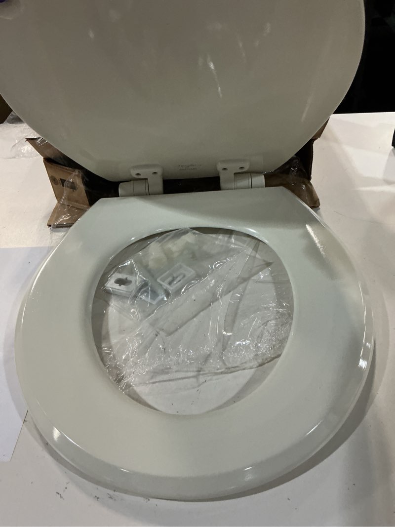 Condition photo showing As Is for mayfair cassel slow close toilet seat, easy clean, non slip premium wood seat, easy install, made in usa, round, bone seat round