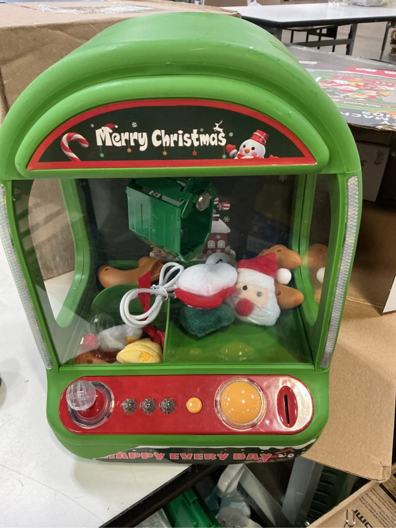 Condition photo showing Good Condition for skirfy christmas claw machine for kids, holiday toys for girls age 6+, mini arcade game vending machine with plush toys and candy dispenser, festive claw game machine, for girls xmas green