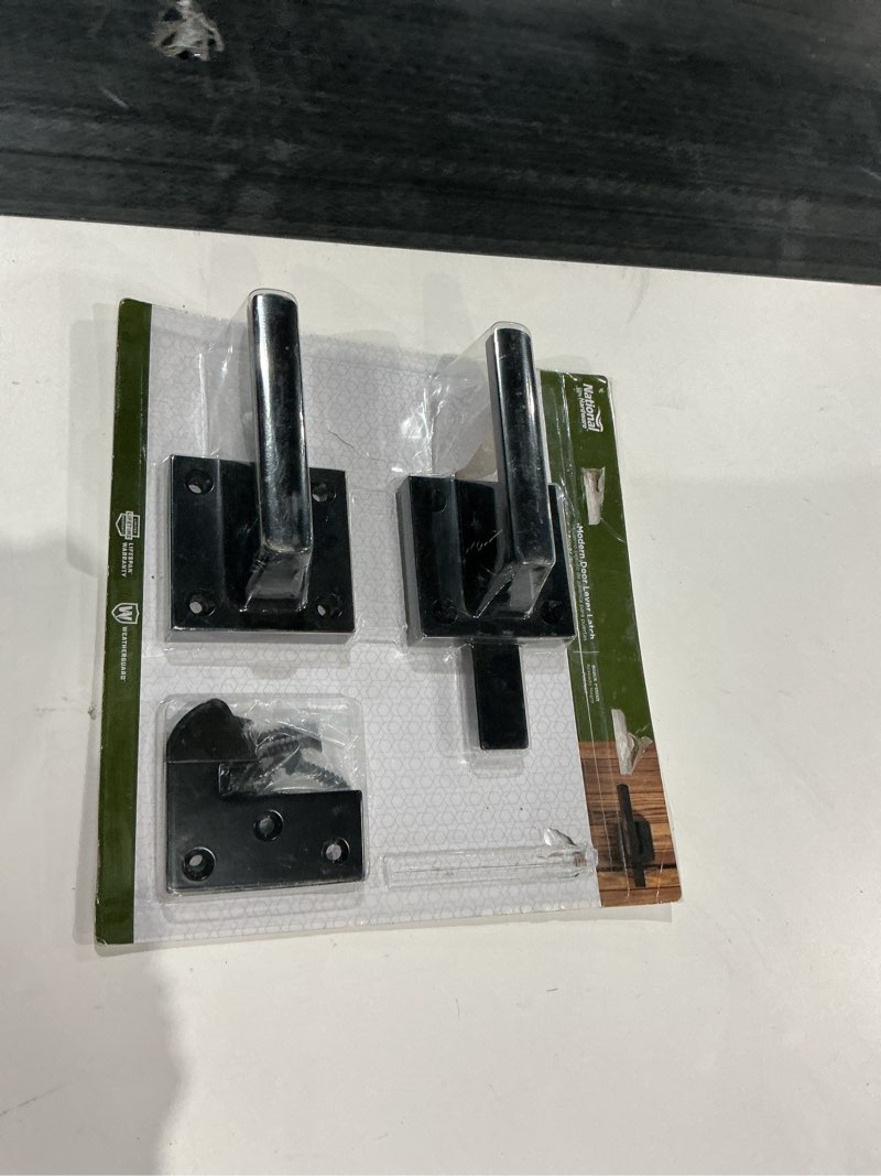Condition photo showing As Is for national hardware modern door lever hatch black finish 