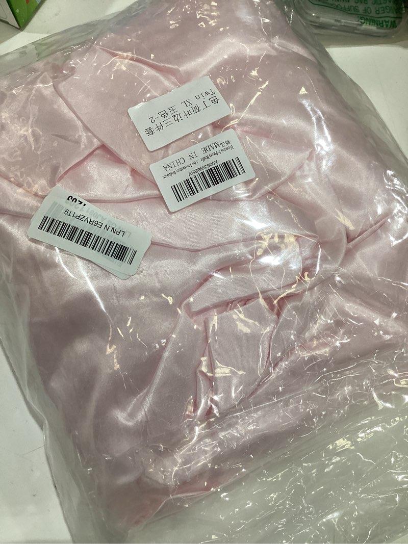 Condition photo showing Good Condition for homiest blush pink twinxl ruffle pillowcase & satin fitted sheet set 2pcs | silky satin protects hair and skin, 15-inch deep pocket, pearlescent romantic rosy glow, easy machine wash care twin xl blush pink