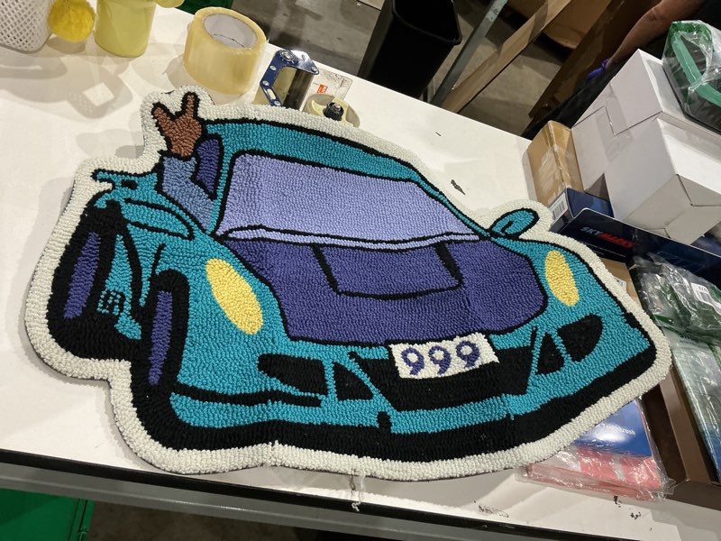 Condition photo showing As Is for lakea enthusiast racing car shaped tufting rug living room bedroom decor carpet embroidered non-slip floor mat doormat home decor (29.5x19.7inch)?brown hand?