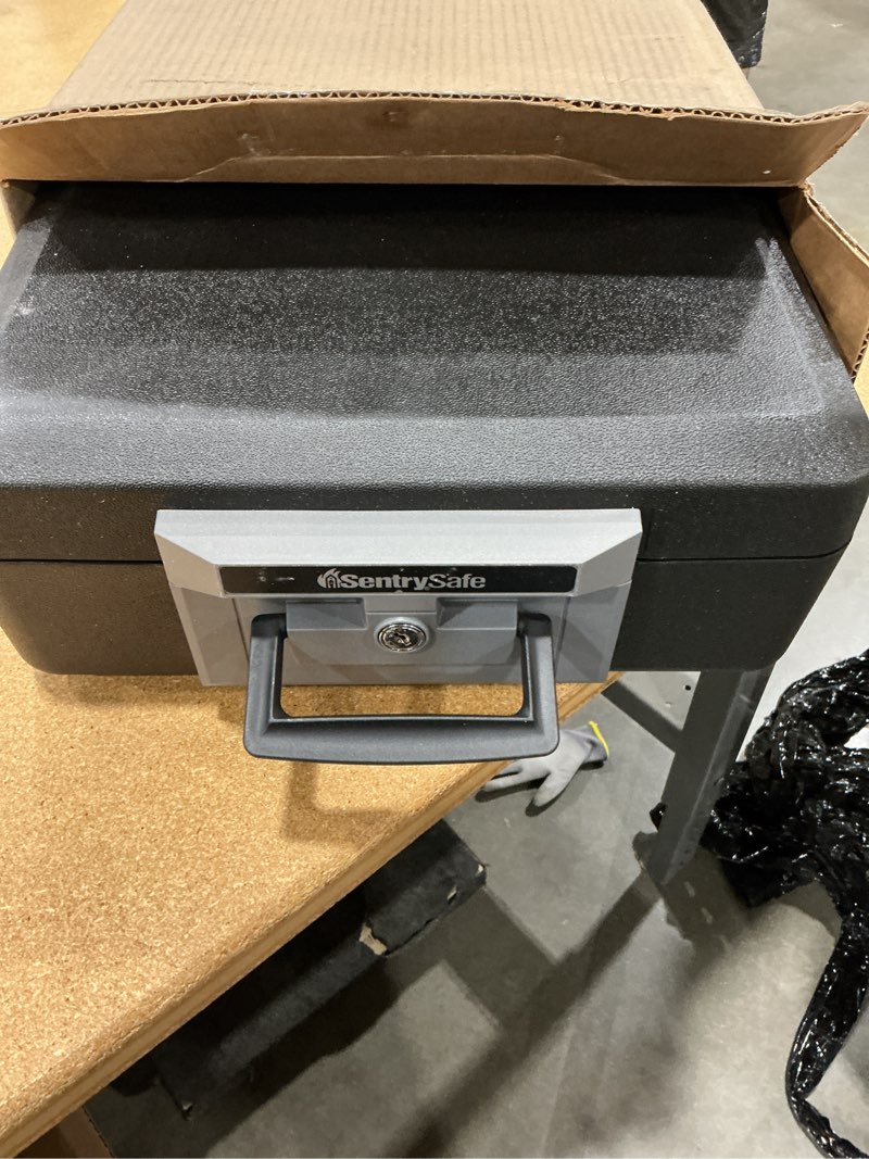 Condition photo showing As Is for missing key sentrysafe fireproof safe box with key lock, chest safe with carrying handle to secure money, jewelry, documents, 0.25 cubic feet, 6.3 x 15.3 x 12.1 inches, 1160