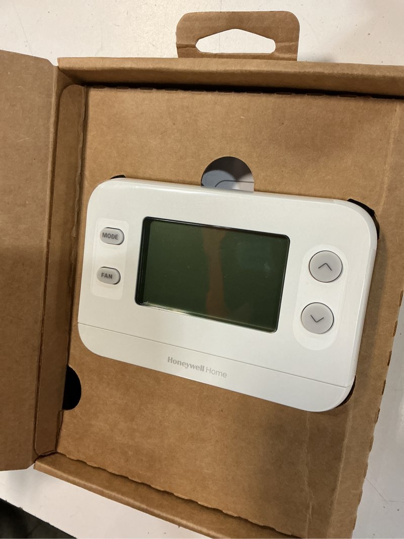 Condition photo showing As Is for x1n non-programmable thermostat, single-stage, 1-heat/1-cool