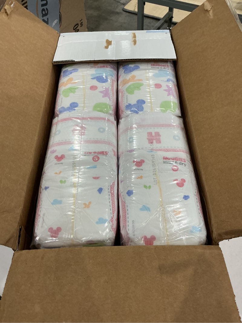 Condition photo showing New/Like New for huggies size 5 diapers, snug & dry baby diapers, size 5 (27+ lbs), 84 count, packaging may vary size 5 84