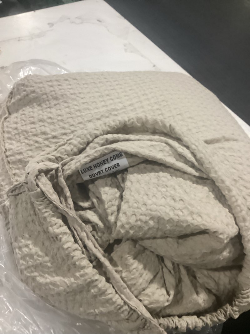 Condition photo showing As Is for organic luxe honeycomb duvet cover