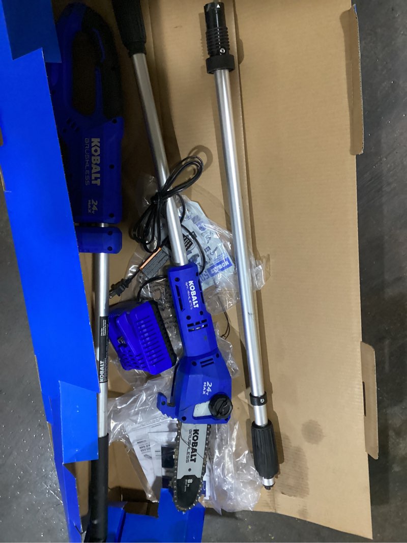 Condition photo showing As Is for (possibly used)kobalt 24-volt 8-in 2 ah electric pole saw battery included , charger included