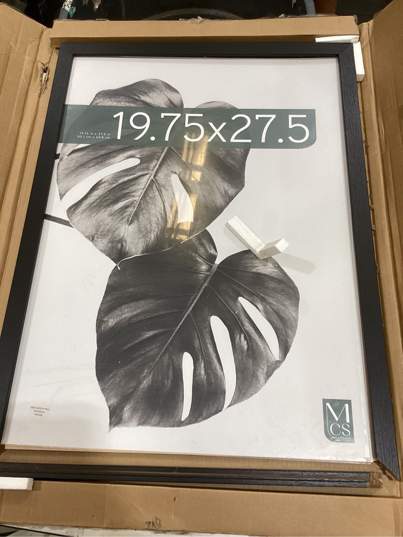 Condition photo showing As Is for mcs studio gallery 19.75x27.5 poster frame black woodgrain, vertical & horizontal wall hanging large picture frame for photos, posters & art prints (1-pack)