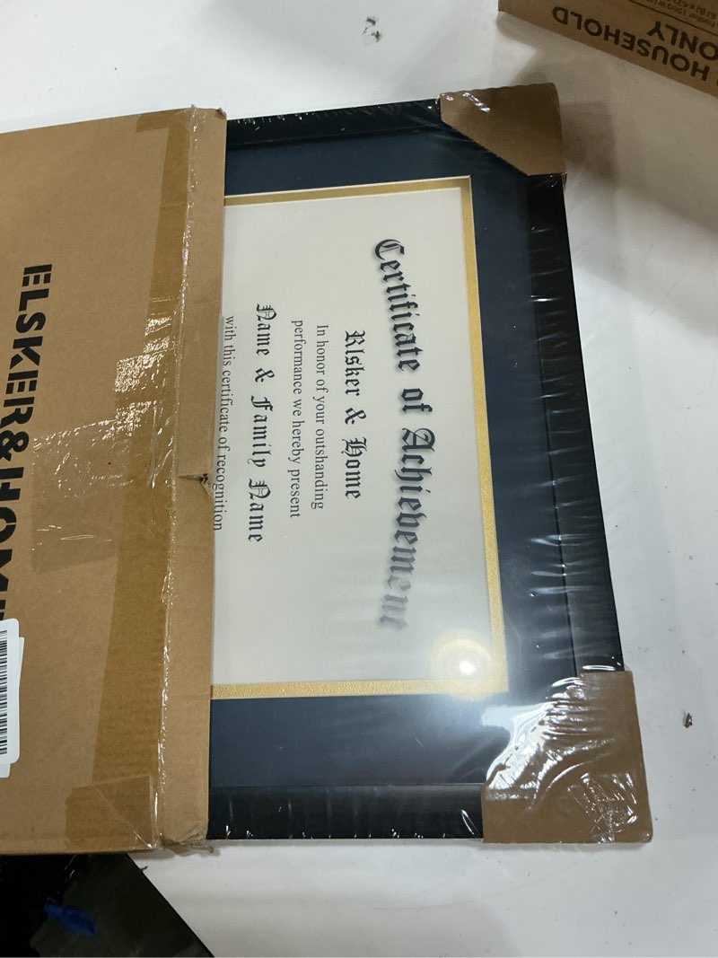 Condition photo showing New/Like New for ELSKER&HOME 8.5x11 Certificate Frame with Blue Mat- Classic Black Color Frame - Displays Diploma 8.5x11 Inch with Mat - 11x14 Inch Without Mat - For Document/Photo(Double Mat Blue with Gold Rim) Black-Blue Mat Plastic, Glass