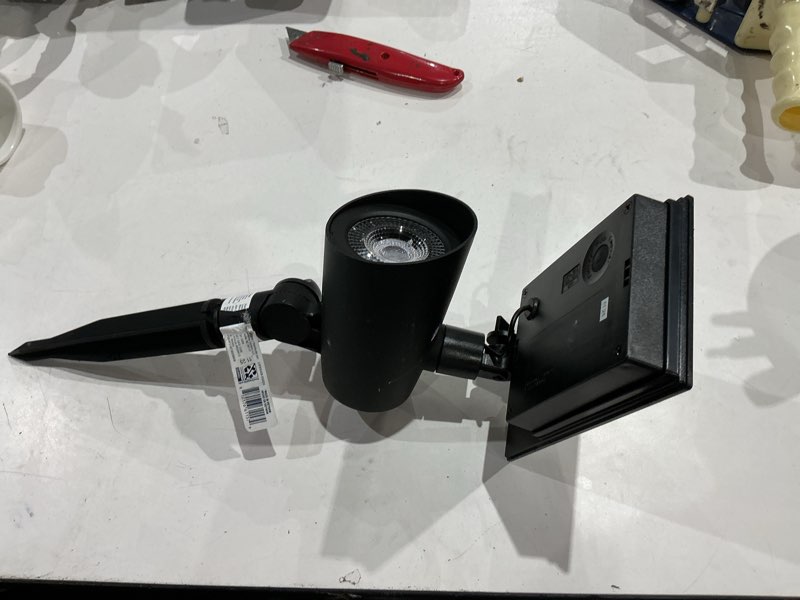 Condition photo showing As Is for harbor breeze 183 -lumens black warm white solar led flood light