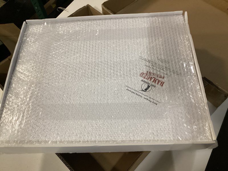 Condition photo showing New/Like New for navy penguin 16x20 foam boards encased in its protective bubble wrap layer, noticeably stamped with a large red  damaged freight