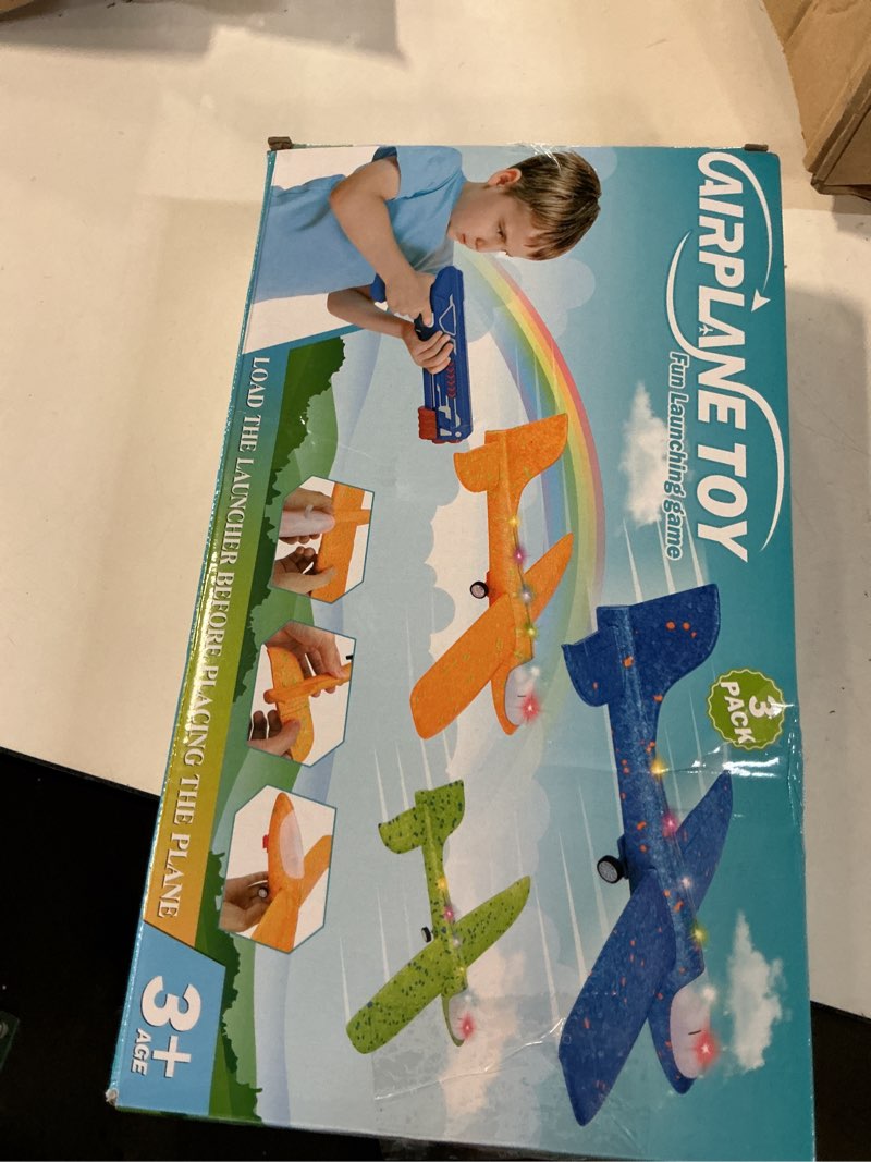 Condition photo showing New/Like New for fuwidvia 3 pack airplane launcher toys, 13.2'' led foam glider plane toy for boys, 2 flight modes outdoor flying toys birthday gifts for boys girls 4 5 6 7 8 9 10 11 12 year old (blue&green&orange)
