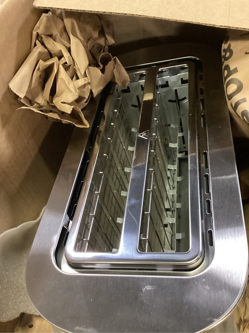 Condition photo showing New/Like New for elite gourmet ect4123x long slot 4 slice toaster, extra wide 1.5" and 5.1" deep slots, bagel, defrost & cancel functions, 6 toast shade settings, fits bagels, waffles, artisan breads, stainless steel 4 slice stainless steel