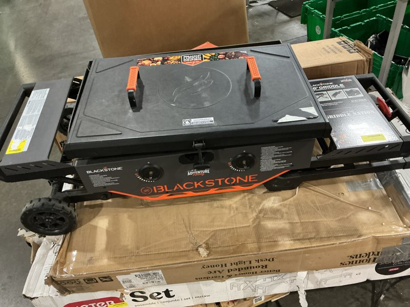 Condition photo showing As Is for blackstone 2357 2-burner 28\" propane omnivore griddle with legs