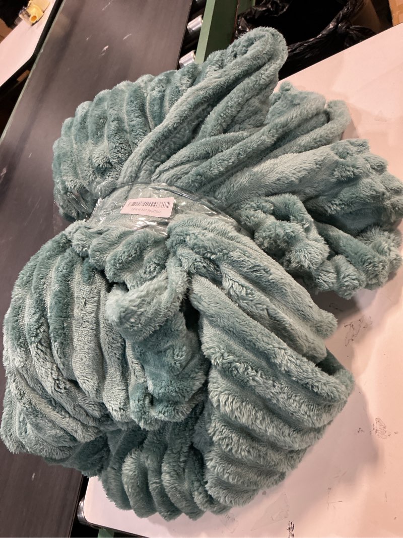Condition photo showing As Is for NEWCOSPLAY Super Soft Queen Blanket Light Teal Premium Silky Flannel Fleece 3D Ribbed Jacquard Lightweight Bed Blanket All Season Use (Light Teal Ribbed, Queen(90"x90")) Light Teal Ribbed Queen(90"x90")
